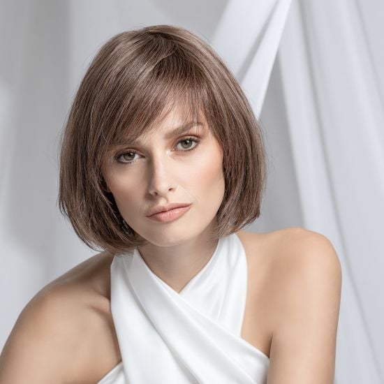 Model wearing a shoulder-length brunette bob human hair piece