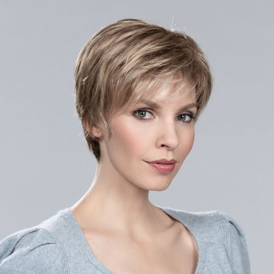 Model wearing a short layered blonde synthetic hair piece