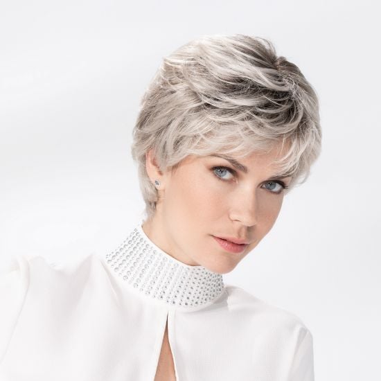 Model wearing a short silver grey synthetic hair piece